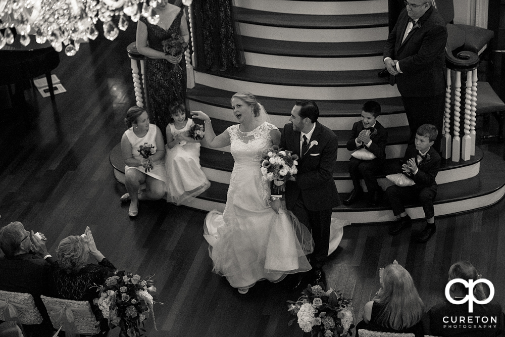 Bride and groom walking back down the aisle.