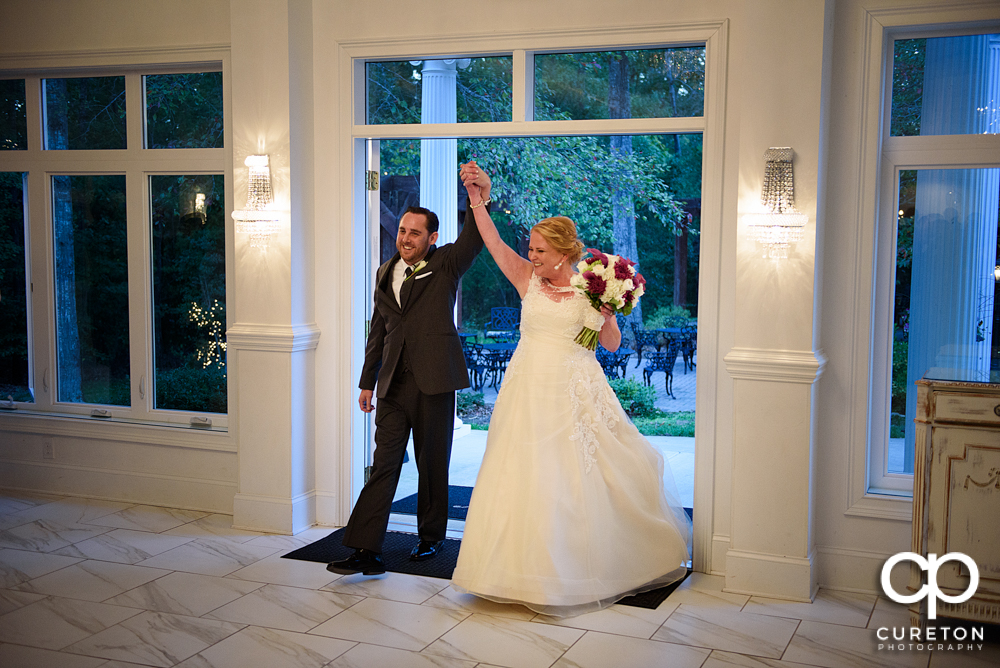 Bride and groom being introduced into the reception.