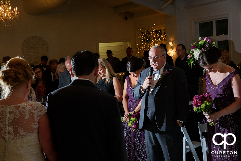 Prayer at the reception.