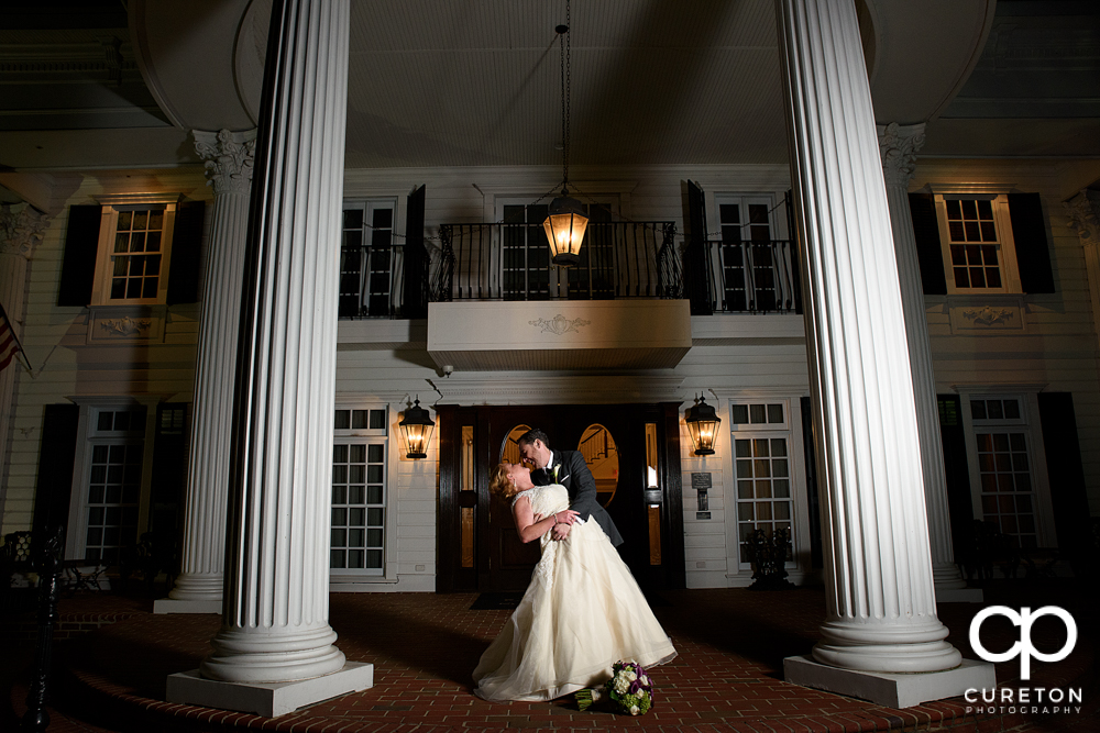 Bride and groom dipping out in front of the Ryan Nicholas Inn.