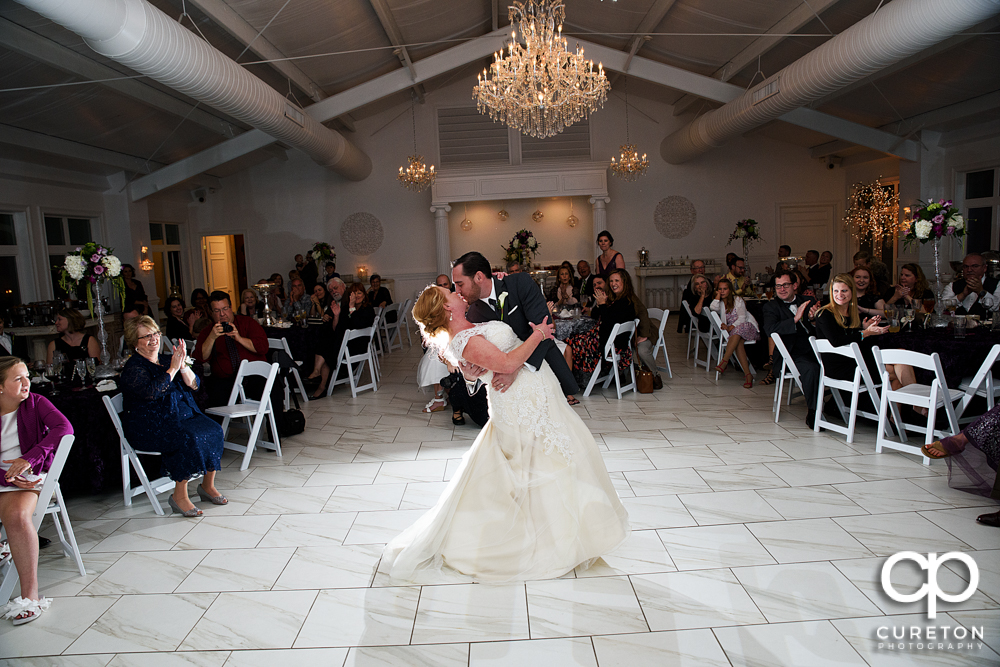 Bride and groom dancing.