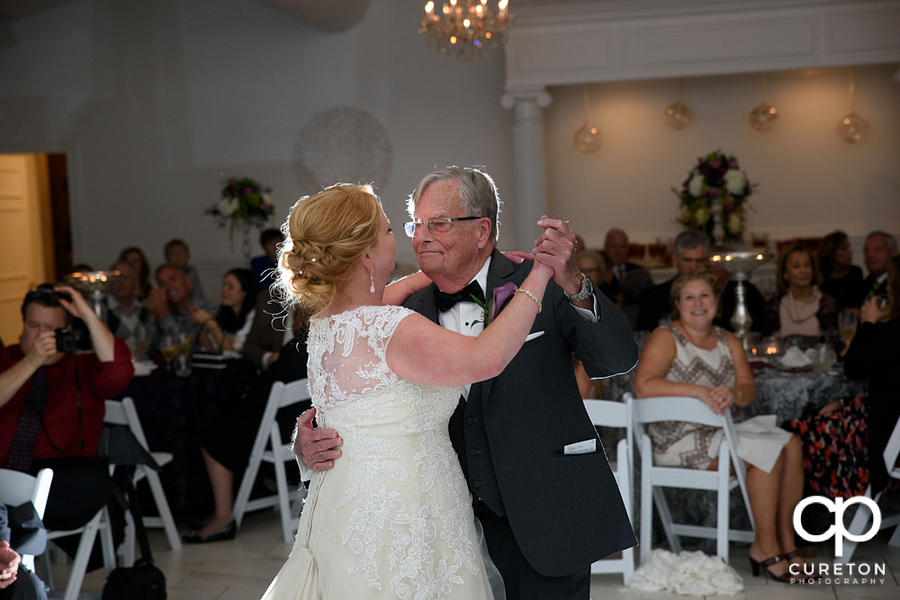 Bride and father dance.