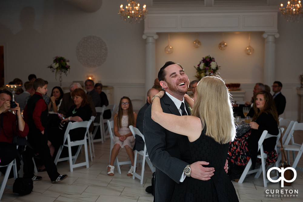 Groom and mother dance.