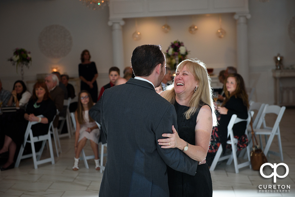 Groom and mother dance.