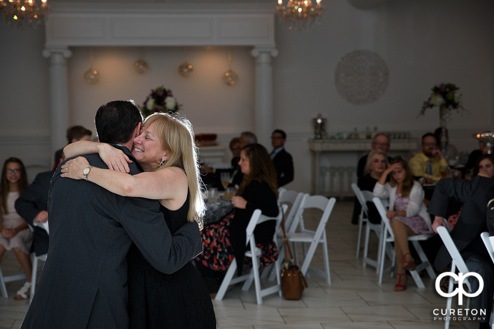 Groom and mother dance.