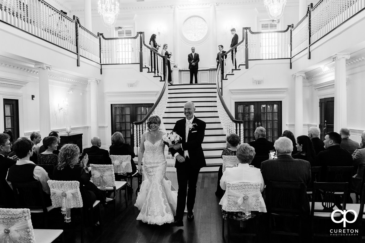 Bride and groom walking back down the aisle during the Ryan Nicholas Inn wedding ceremony.