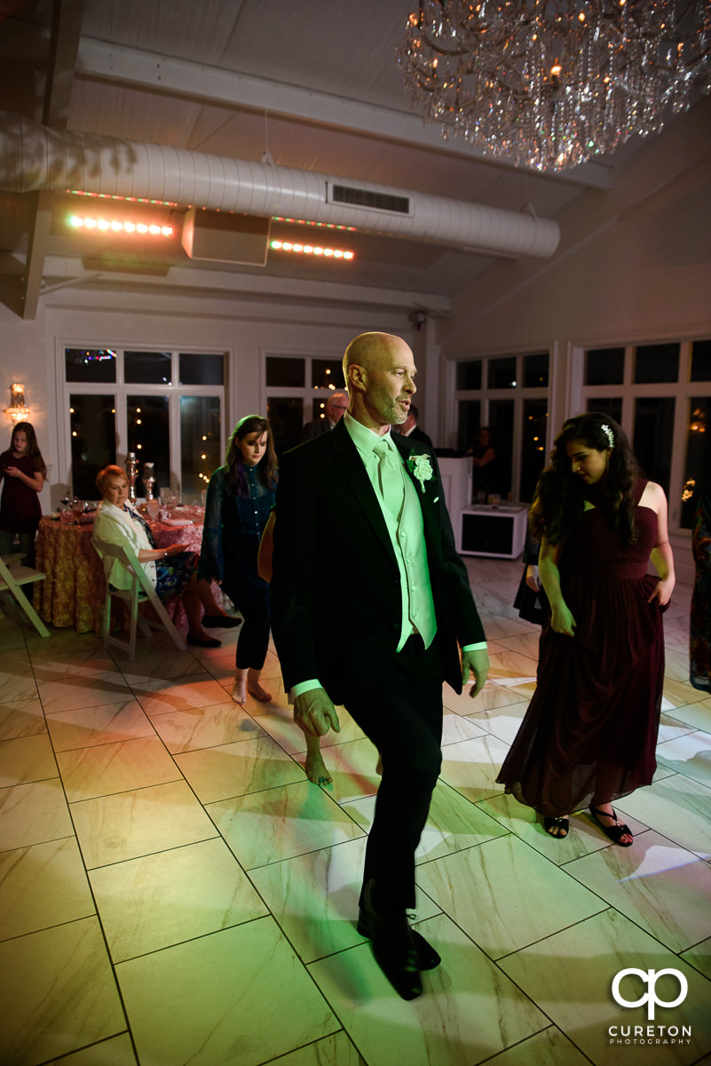 Wedding guests dancing during the Ryan Nicholas Inn wedding reception.
