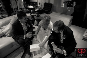 Bride and groom signing the marriage license.