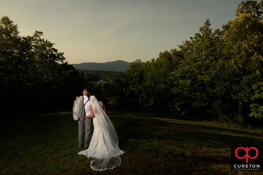 Couple staring off into the mountain view after their Song Hill Reserve wedding.