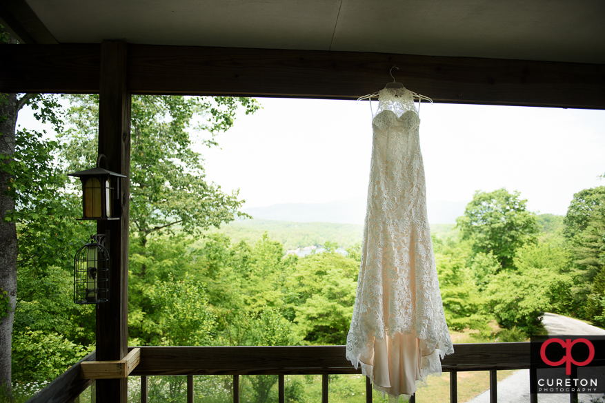 Wedding dress hanging outside.