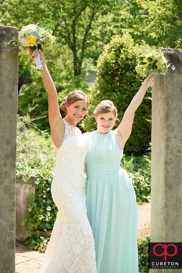 Bride having fun posing with her brdesmaids.