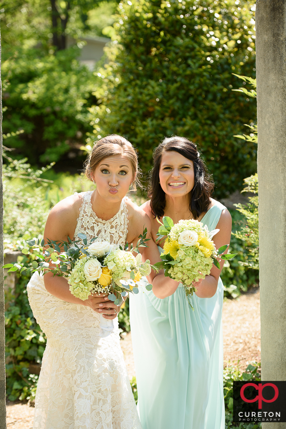 Bride having fun posing with her brdesmaids.