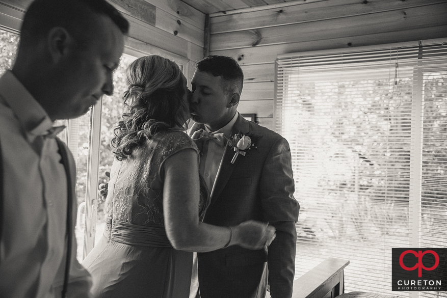 Groom kissed his mom before the wedding.