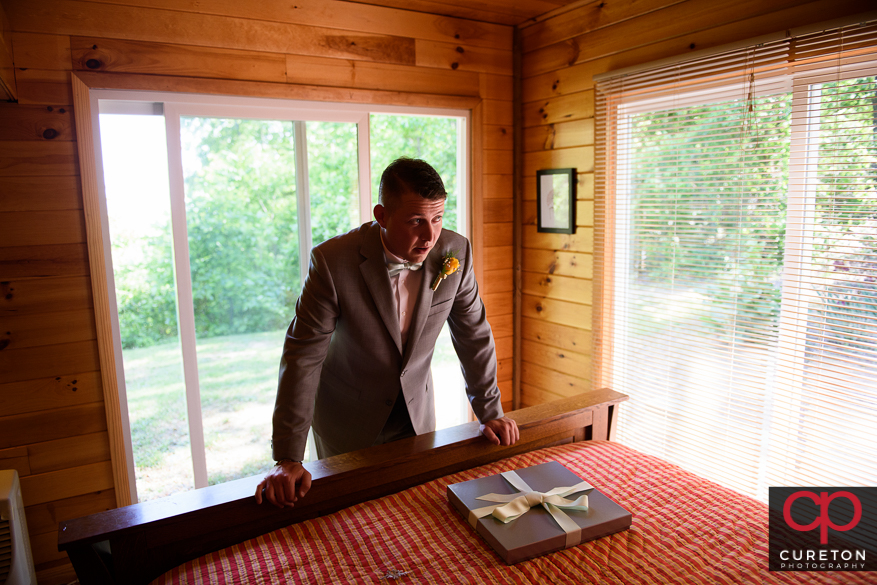 The groom receives his gift from his bride to be.