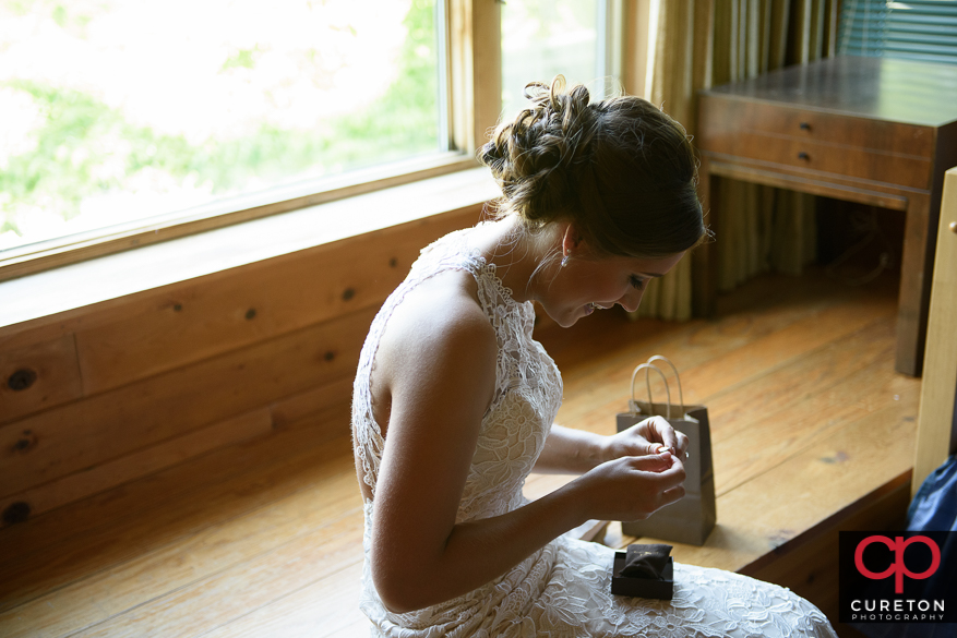 The bride receives her gift from the groom.