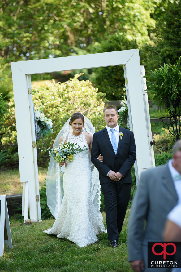 The bride makes her grand entrance.