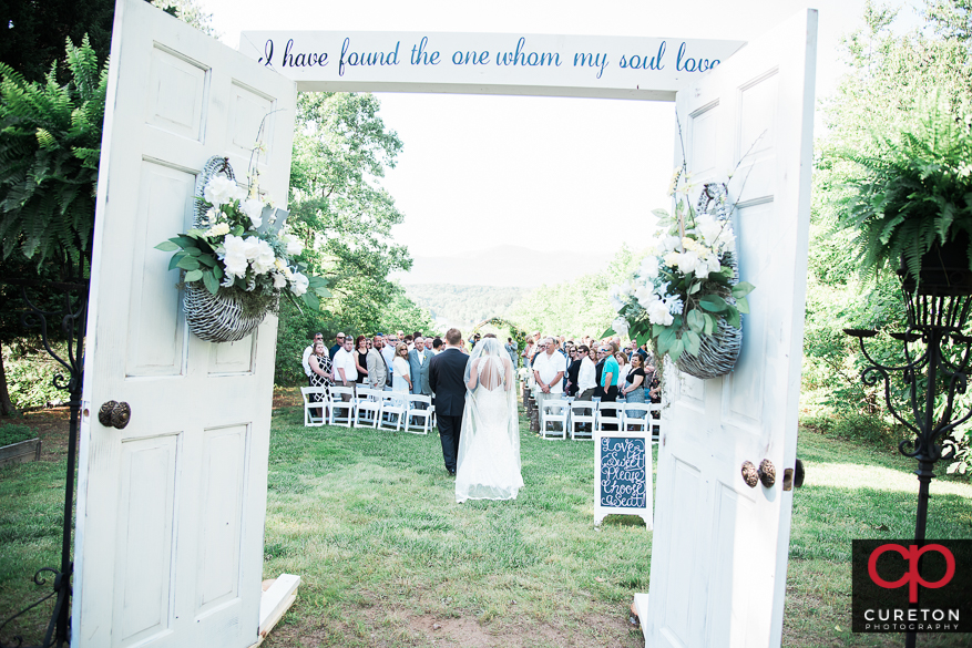 The bride walking down the aisle.