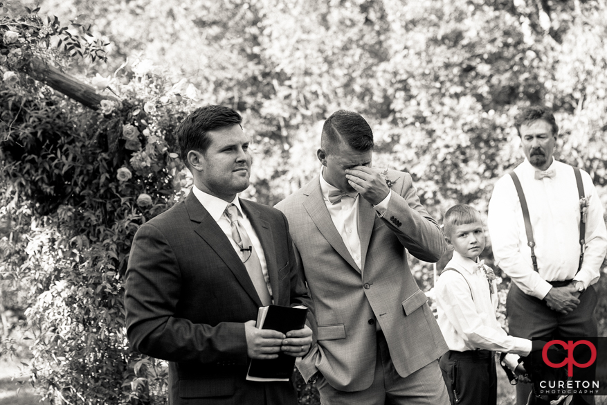 Groom tears up when he sees his bride for the first time.