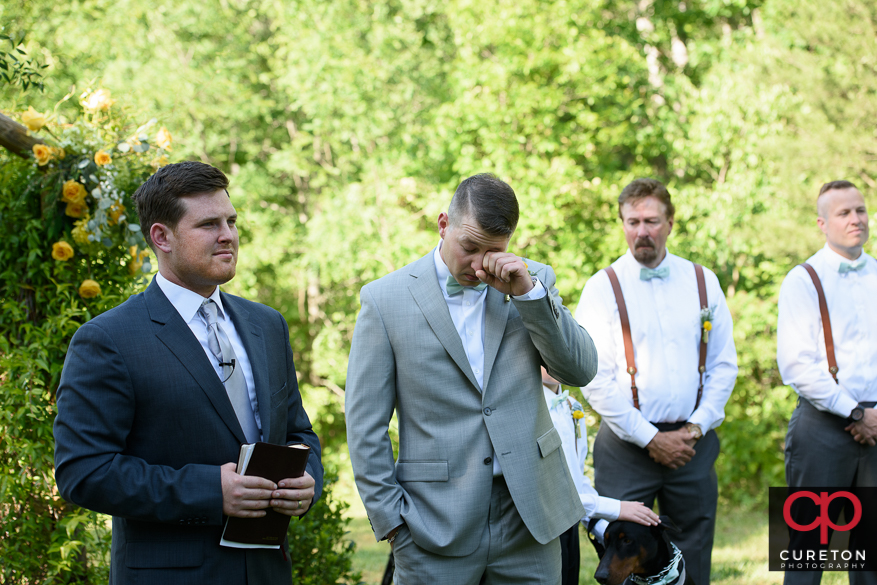 Groom tears up when he sees his bride for the first time.