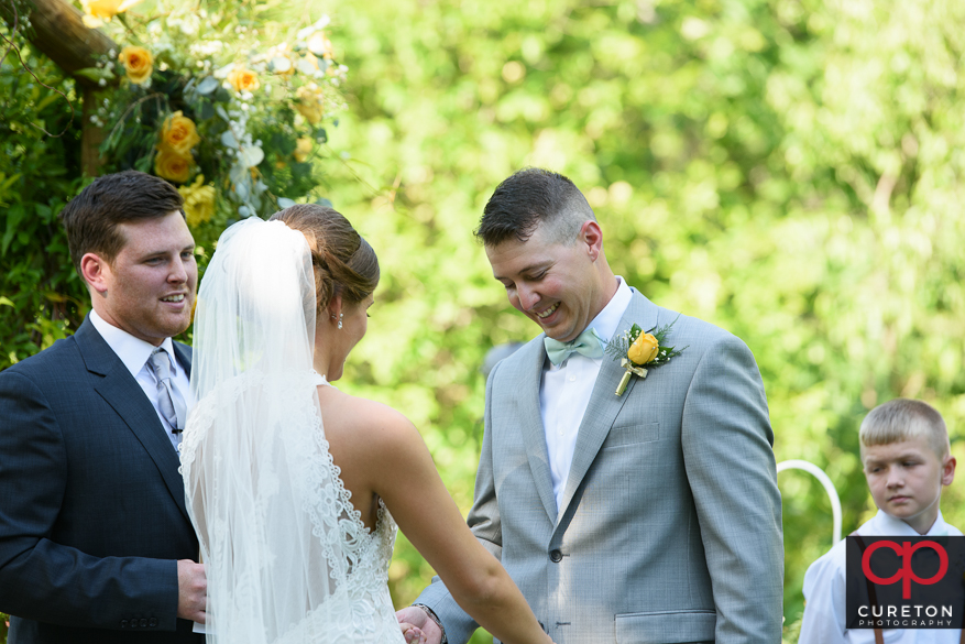 Groom tears up when he sees his bride for the first time.