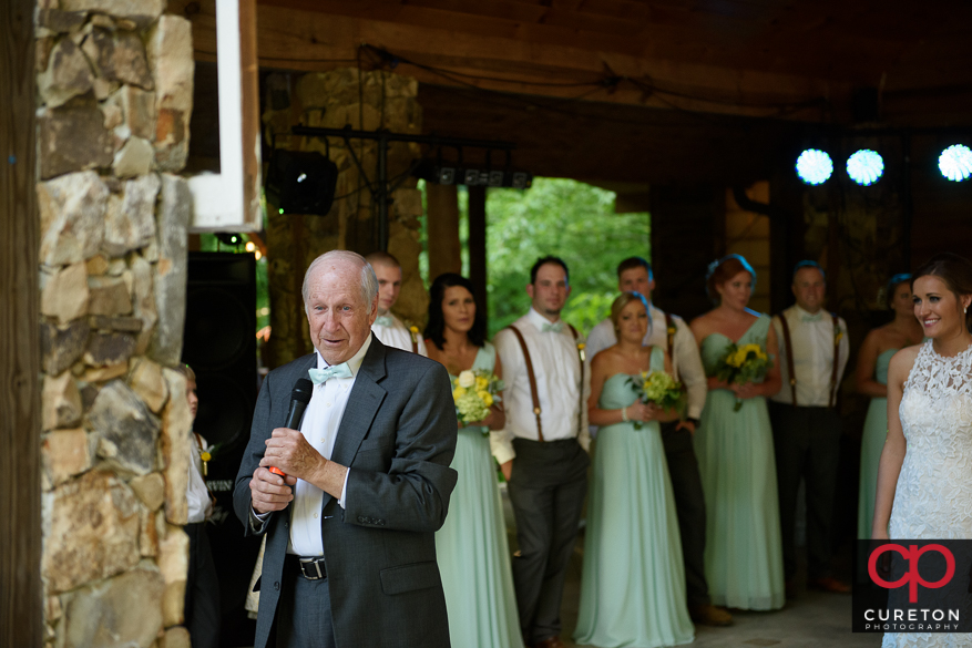 Grandpa says the prayer.