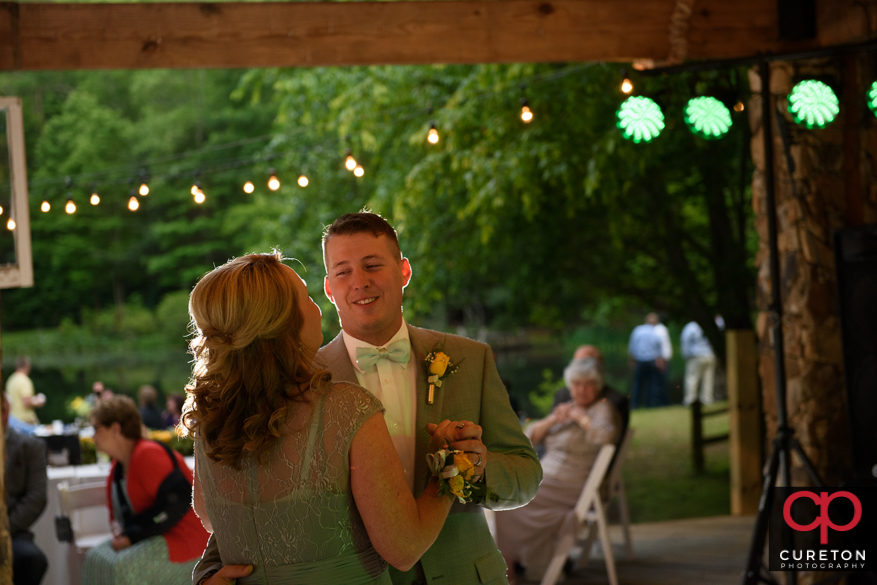 Bride and her mom dancing.