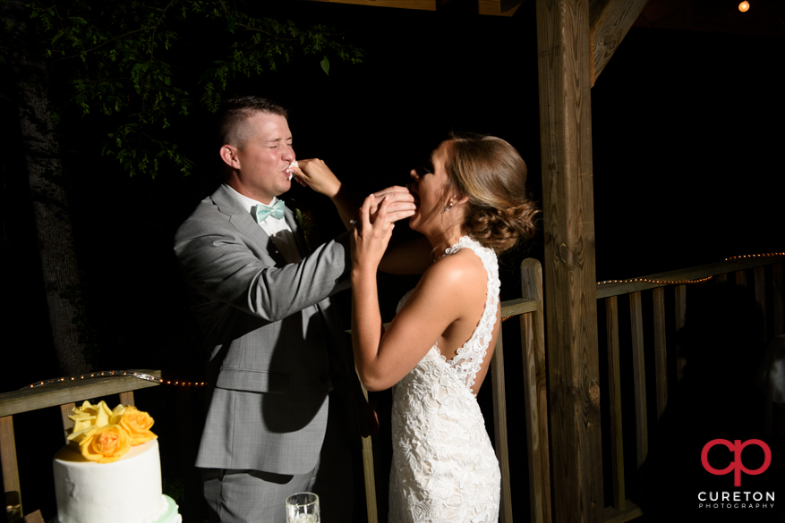 Bride and groom cut the cake.