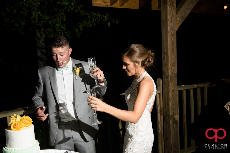 Bride and groom cut the cake.