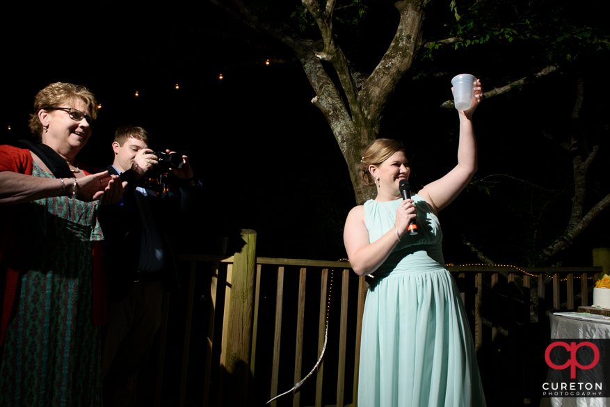 Toasting the couple.