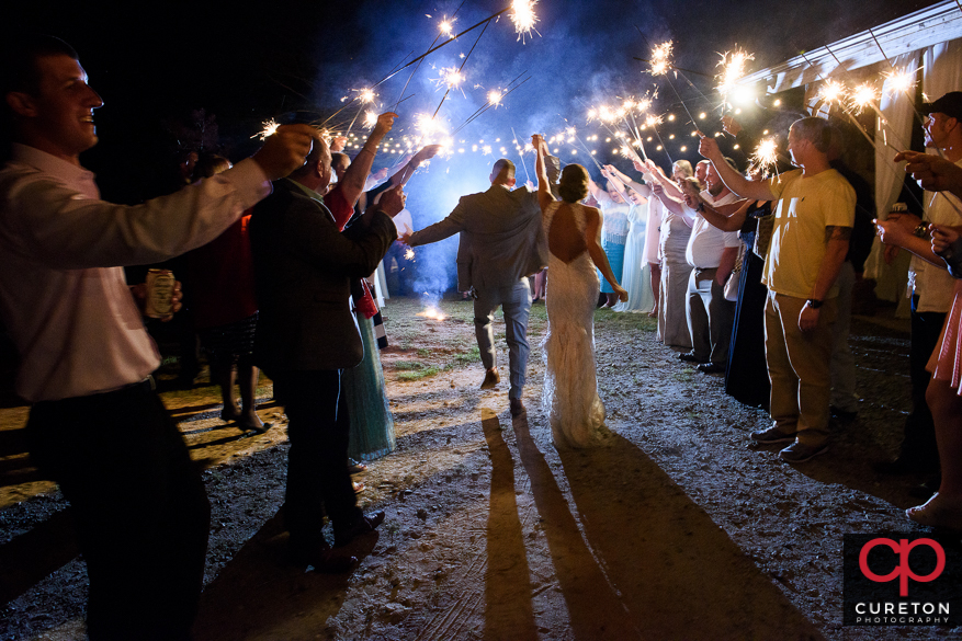 Bride and groom have an epic sparkler leave after the wedding reception at Song Hill Reserve.