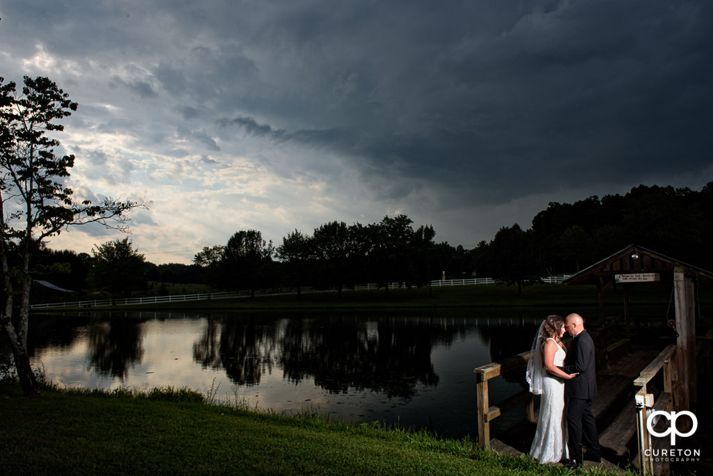 Bride and groom at sunset at the South Wind Ranch, a wedding venue in Travelers Rest, SC.