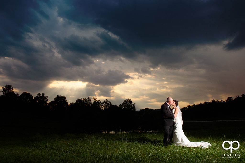 Bride and room at sunset after their wedding at South Wind Ranch in Travelers Rest SC.