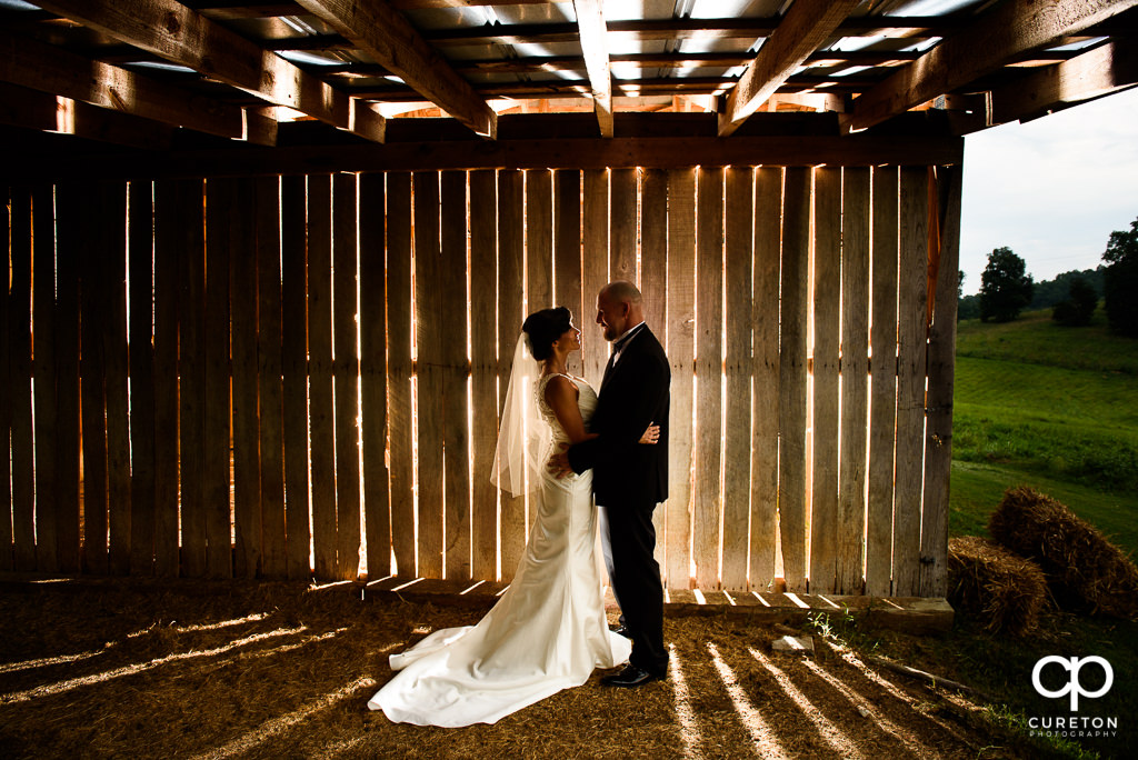 Bride and Groom in front of the barn after their wedding at South Wind Ranch in Travelers Rest SC.