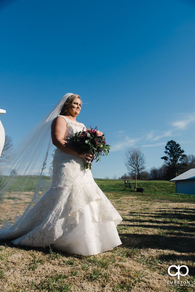 Bride walking down the aisle during her South Wind Ranch wedding in Travelers Rest,SC.