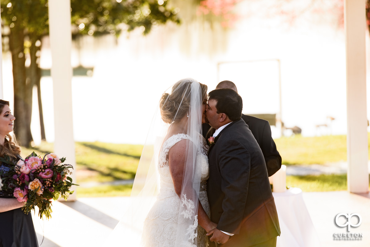 First kiss during their South Wind Ranch wedding in Travelers Rest,SC.