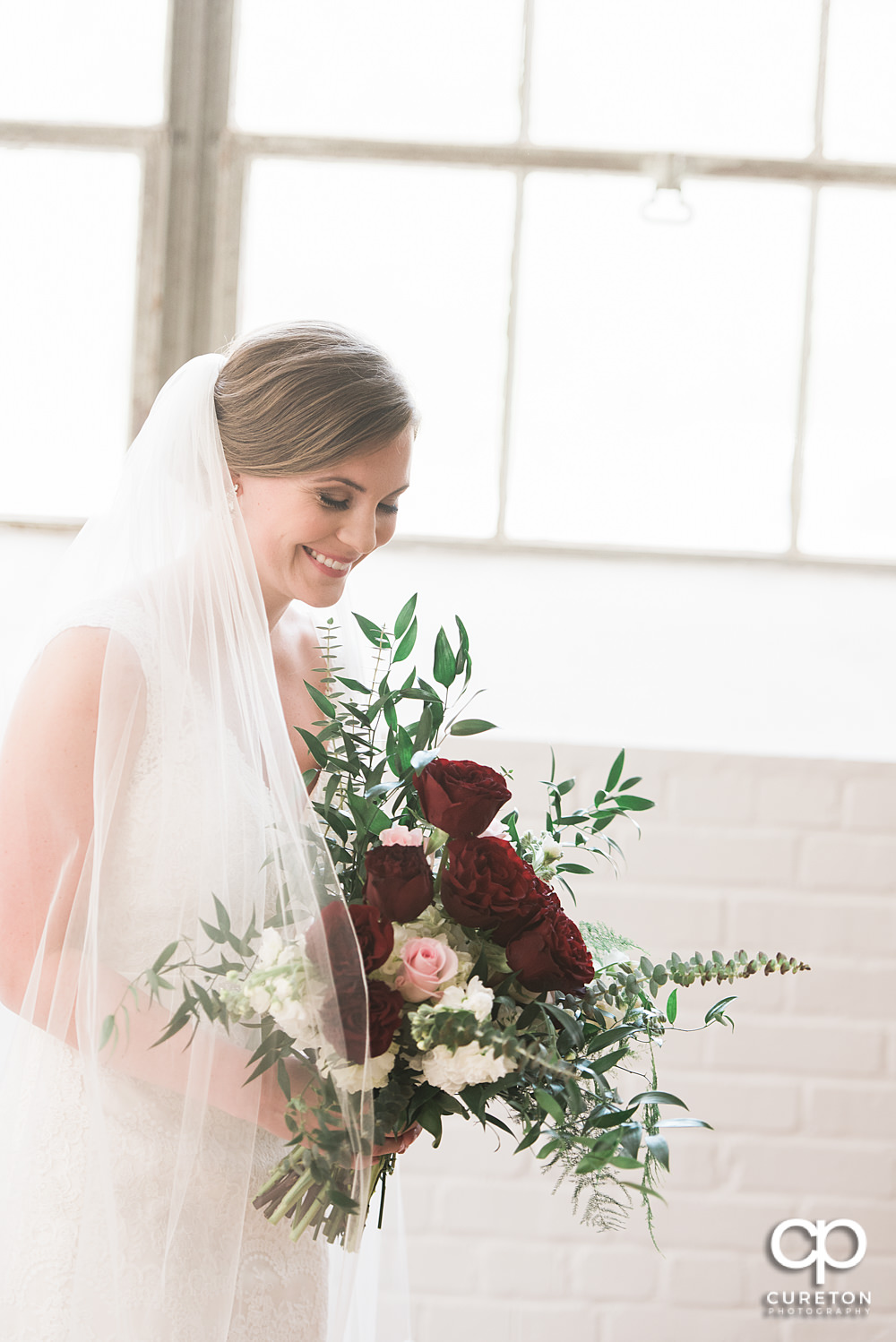 Bride laughing at Southern Bleachery.