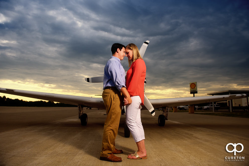 Future bride and groom at sunset during a Spartanburg Airport engagement session.