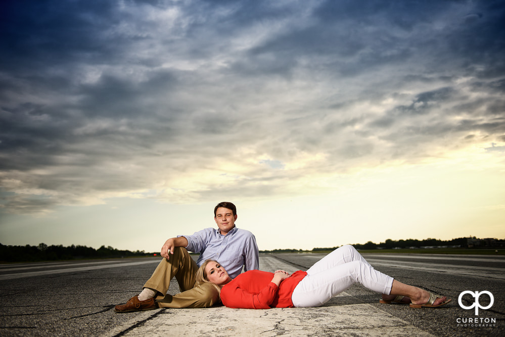 Bride and groom at sunset on the runway during a Spartanburg Airport engagement session.