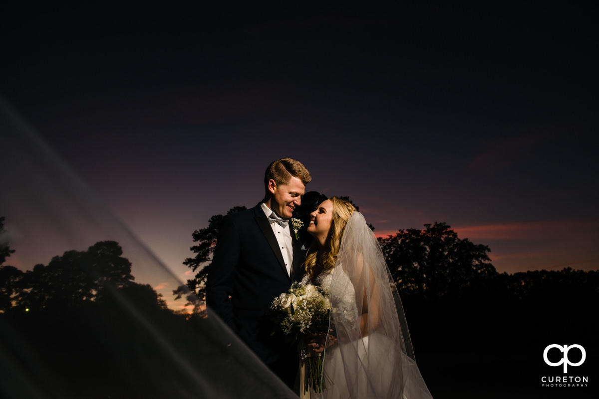 Bride and groom at sunset after their Spartanburg Country Club wedding.
