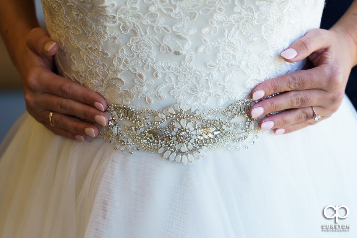 Intricate detail on the bride's dress.