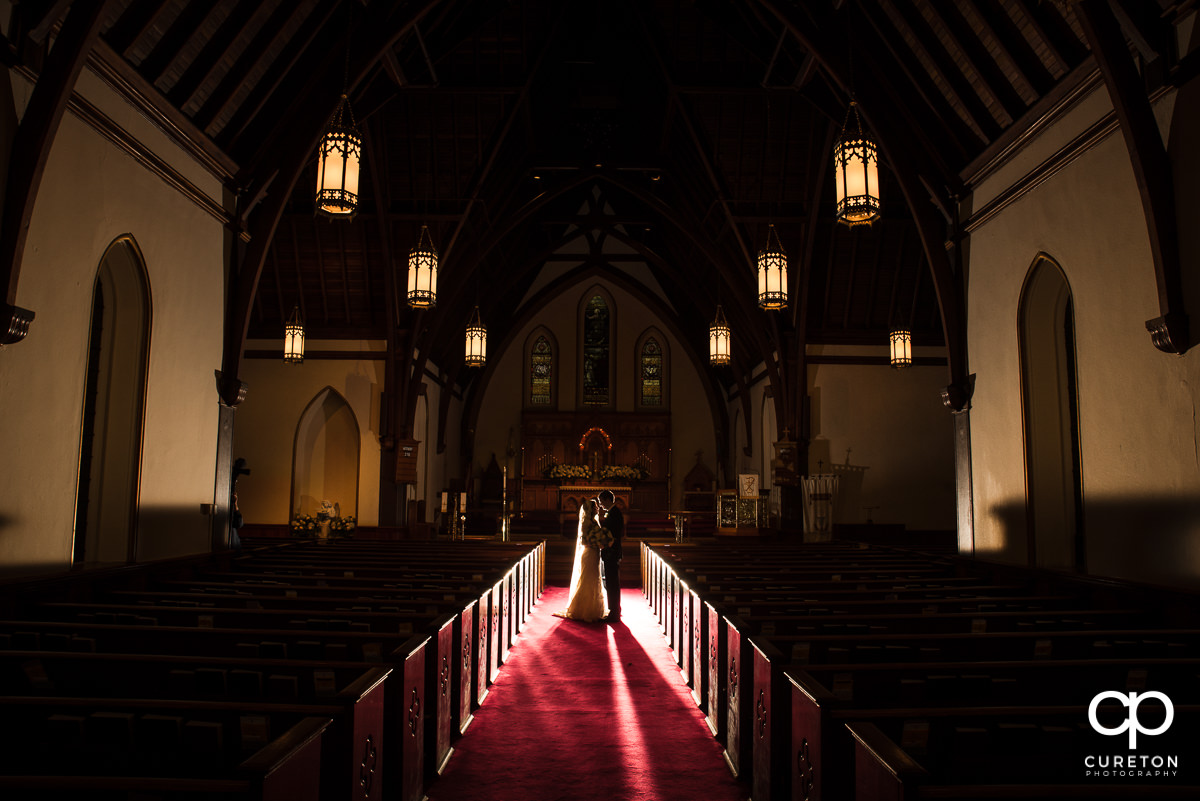 Bride and groom backlit by a Magmod Magsphere at their wedding at the Church of the Advent in Spartanburg,SC.