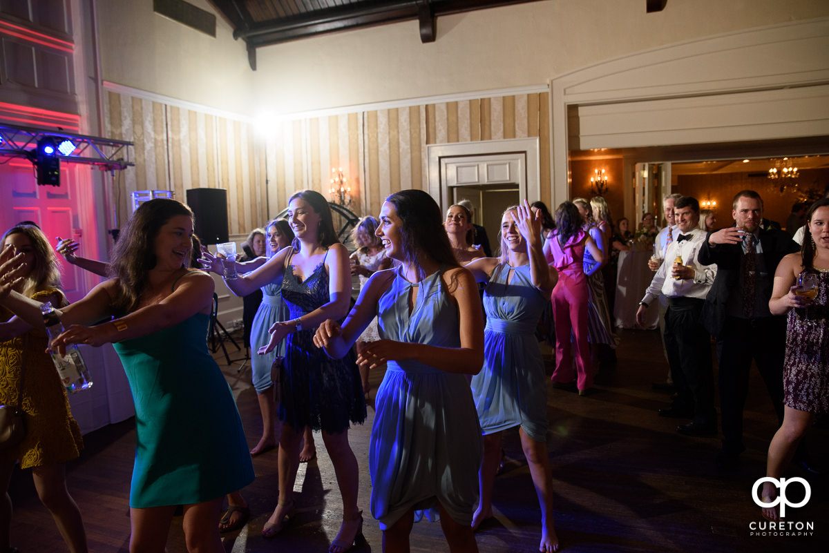 Wedding guests dancing to the sounds of DJ Ben Bruud at the wedding reception at Spartanburg Country Club.
