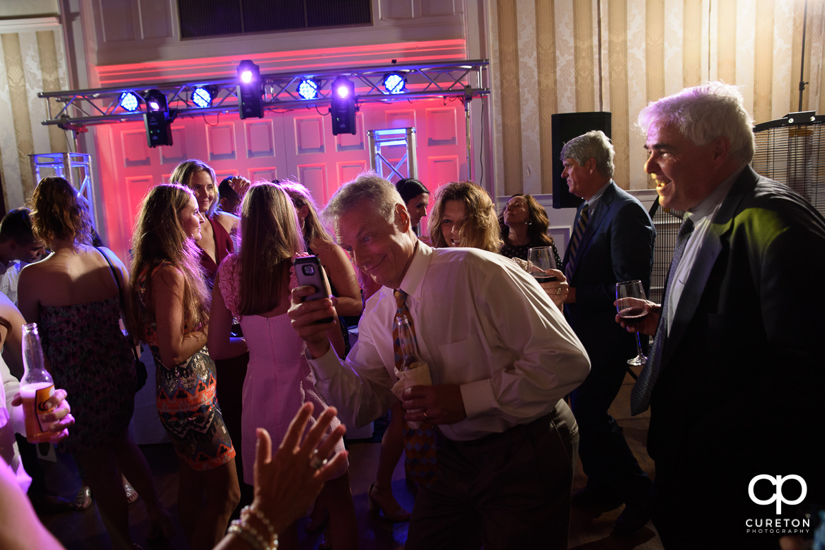 Wedding guests dancing to the sounds of DJ Ben Bruud at the wedding reception at Spartanburg Country Club.