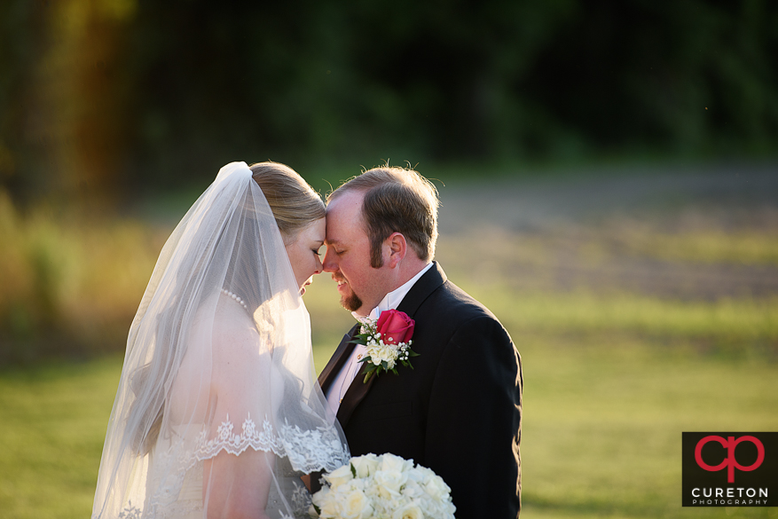 Couple posing for some shots after their Sumter,SC wedding.