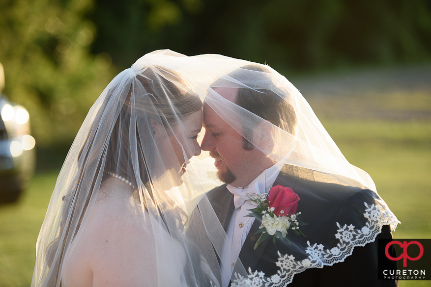 Couple posing for some shots after their Sumter,SC wedding.