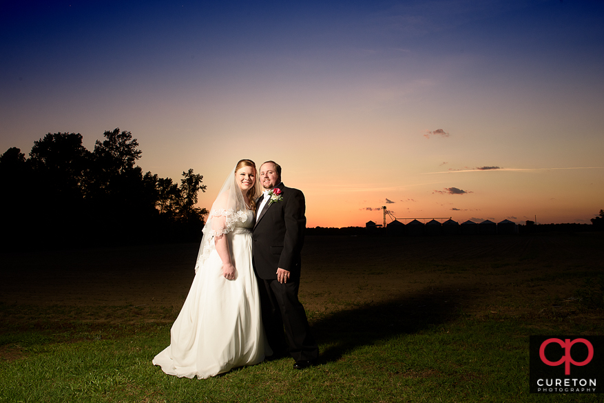 Couple at sunset near a farm in Sumter,SC.