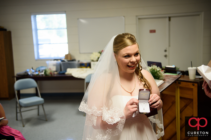 Bride and groom exchanging gifts,