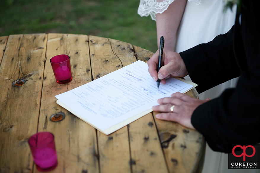 The signing of the marriage license..