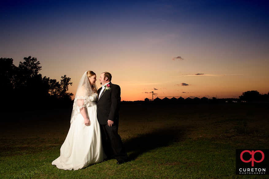 Bride and groom at sunset.