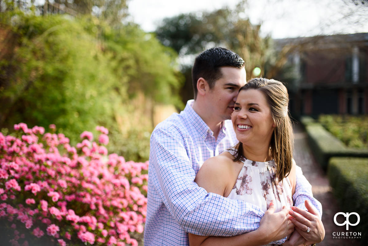 Man holding his fiancee during a Furman engagement session.
